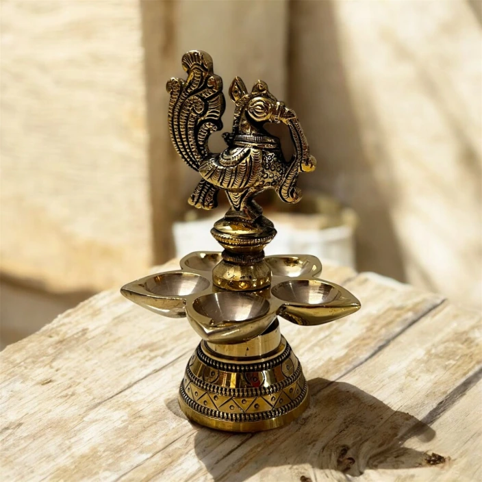 brass peacock diya 